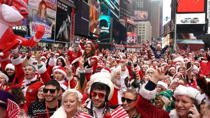 Thousands of Santa Clauses flood the streets of New York City. Welcome to SantaCon