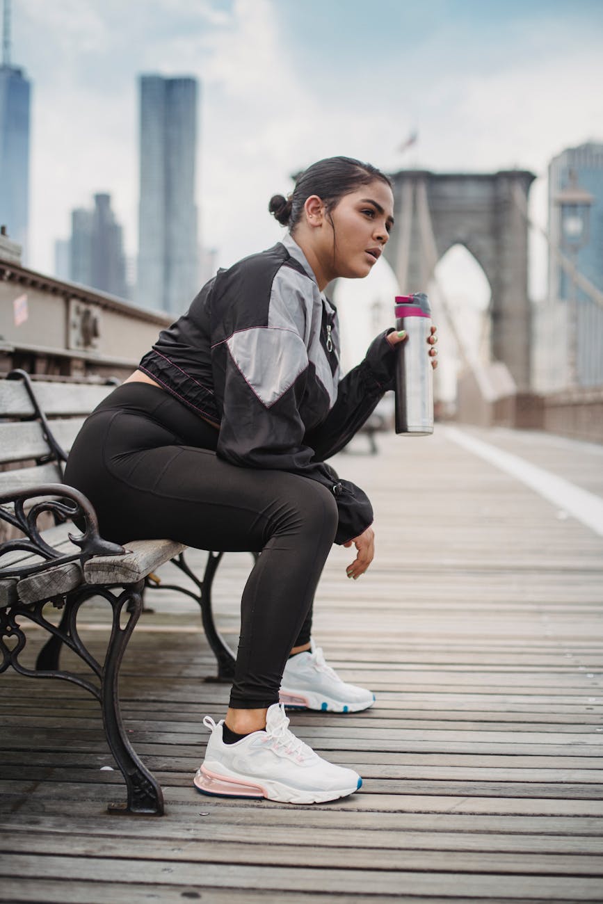Healthy Family Travel Tips for New York City Vacations 2 woman in sports clothing sitting on a bench and drinking water
